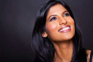 Young woman smiling after eyelid reconstruction